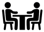 people_table-removebg-preview An icon showing two people talking at a table
